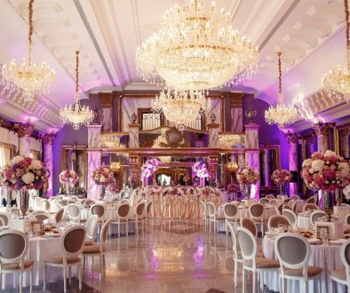 Luxurious dinner hall with large crystal chandeliers hanging fro